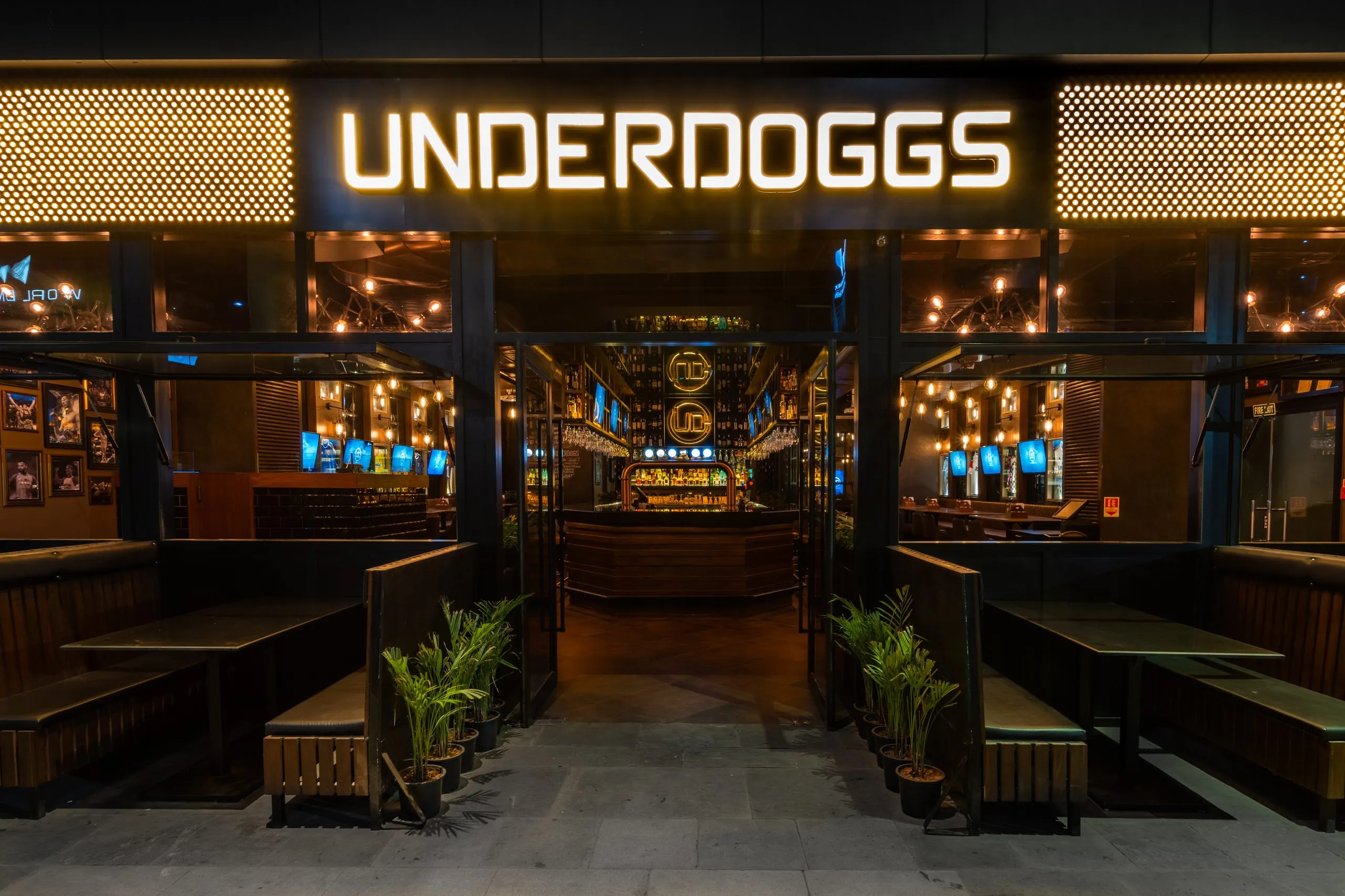 The illuminated Underdoggs fascia and terrace booths at Aerocity, New Delhi